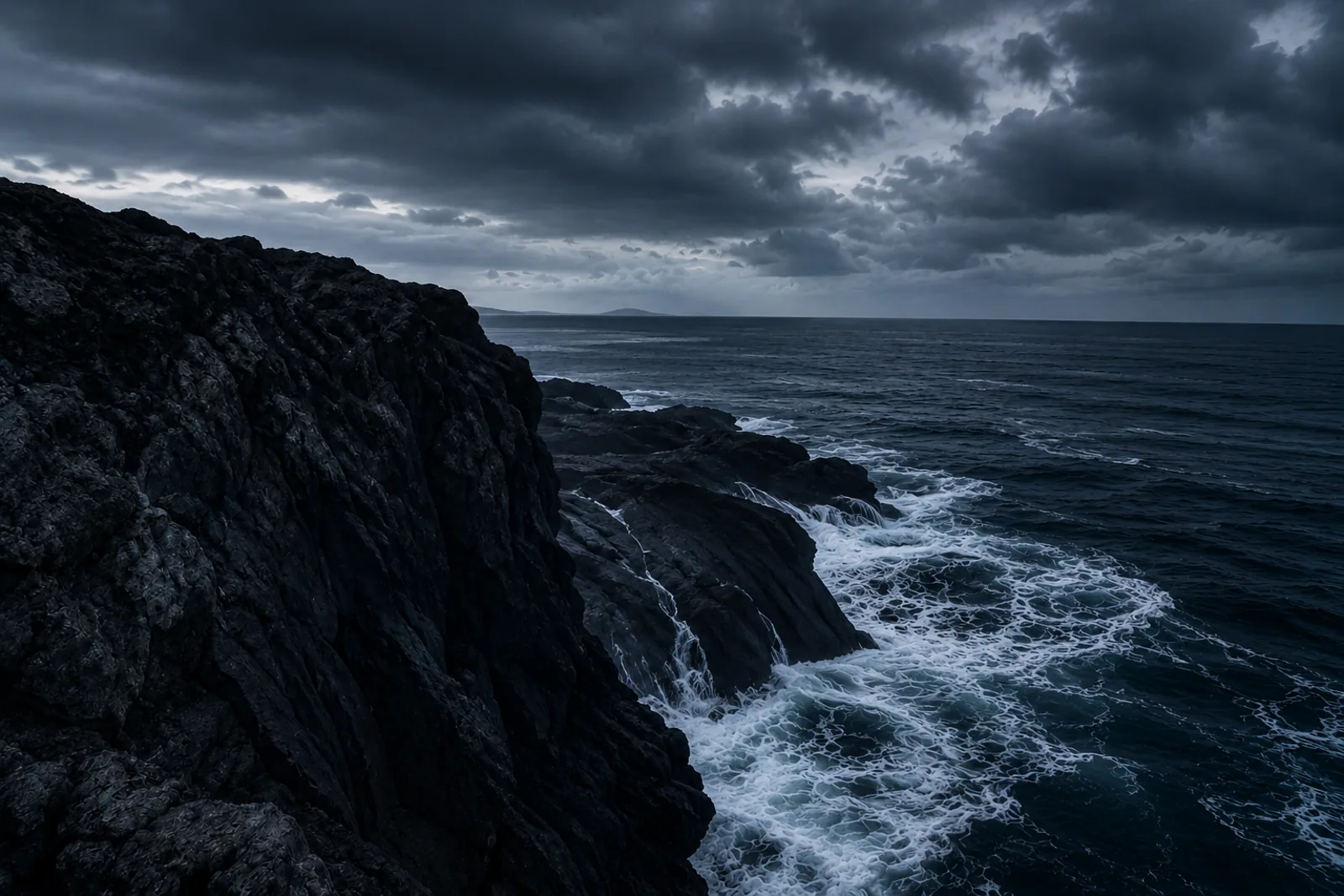 Remote coastline reference with dark cliffs and cold ocean